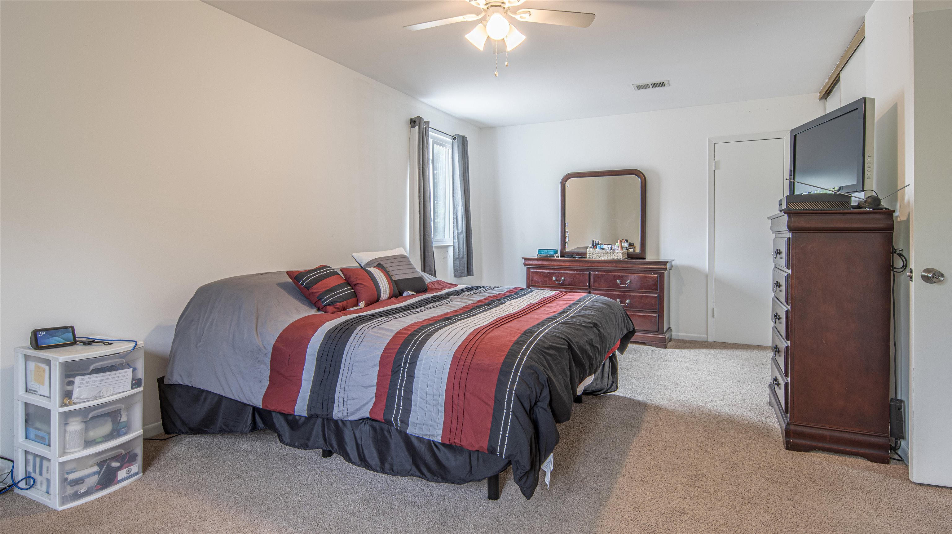 102 Mason Clementon, NJ 08021 - Photo 7 of 12 a bedroom with a bed and a chandelier