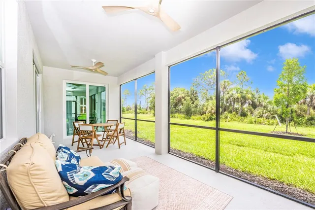 a view of a dining room with furniture window and outside view