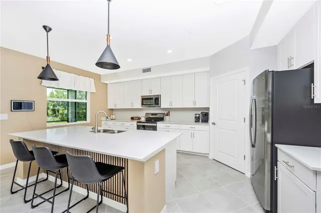 a view of a livingroom with furniture and a window