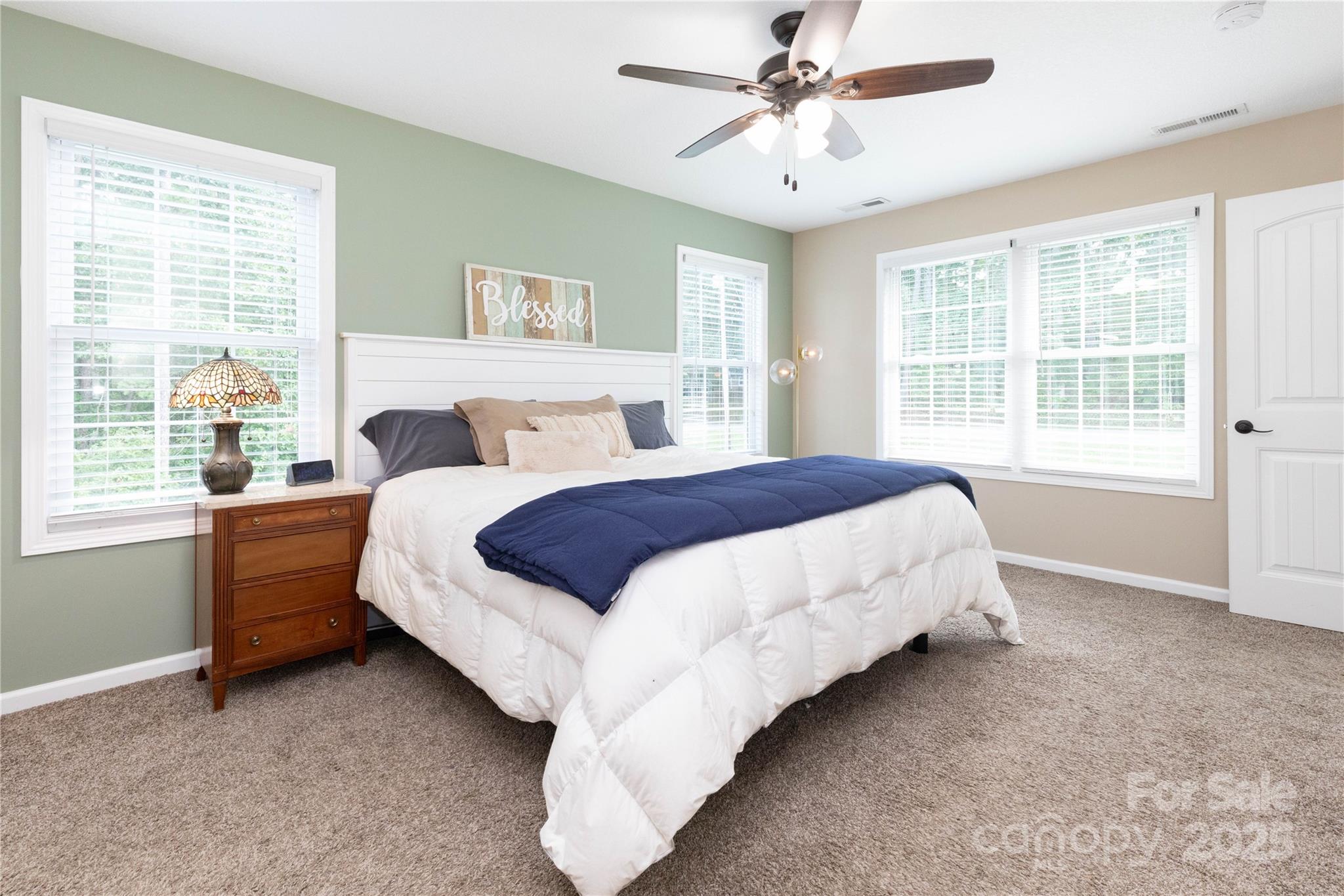 460 Panther Branch Road Alexander, NC 28701 - Photo 23 of 32 a bed sitting in a bedroom next to a window