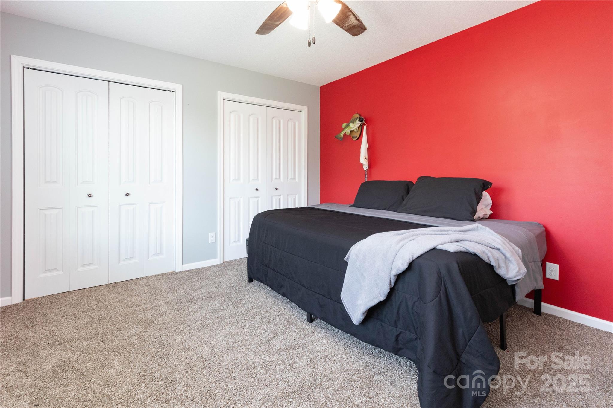 460 Panther Branch Road Alexander, NC 28701 - Photo 26 of 32 a bedroom with a bed and a chandelier