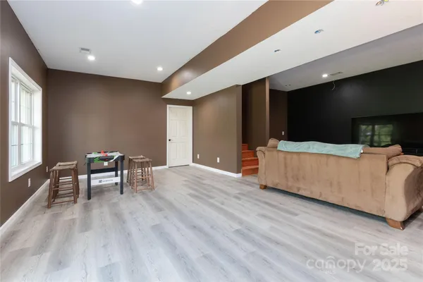 a living room with furniture and a table