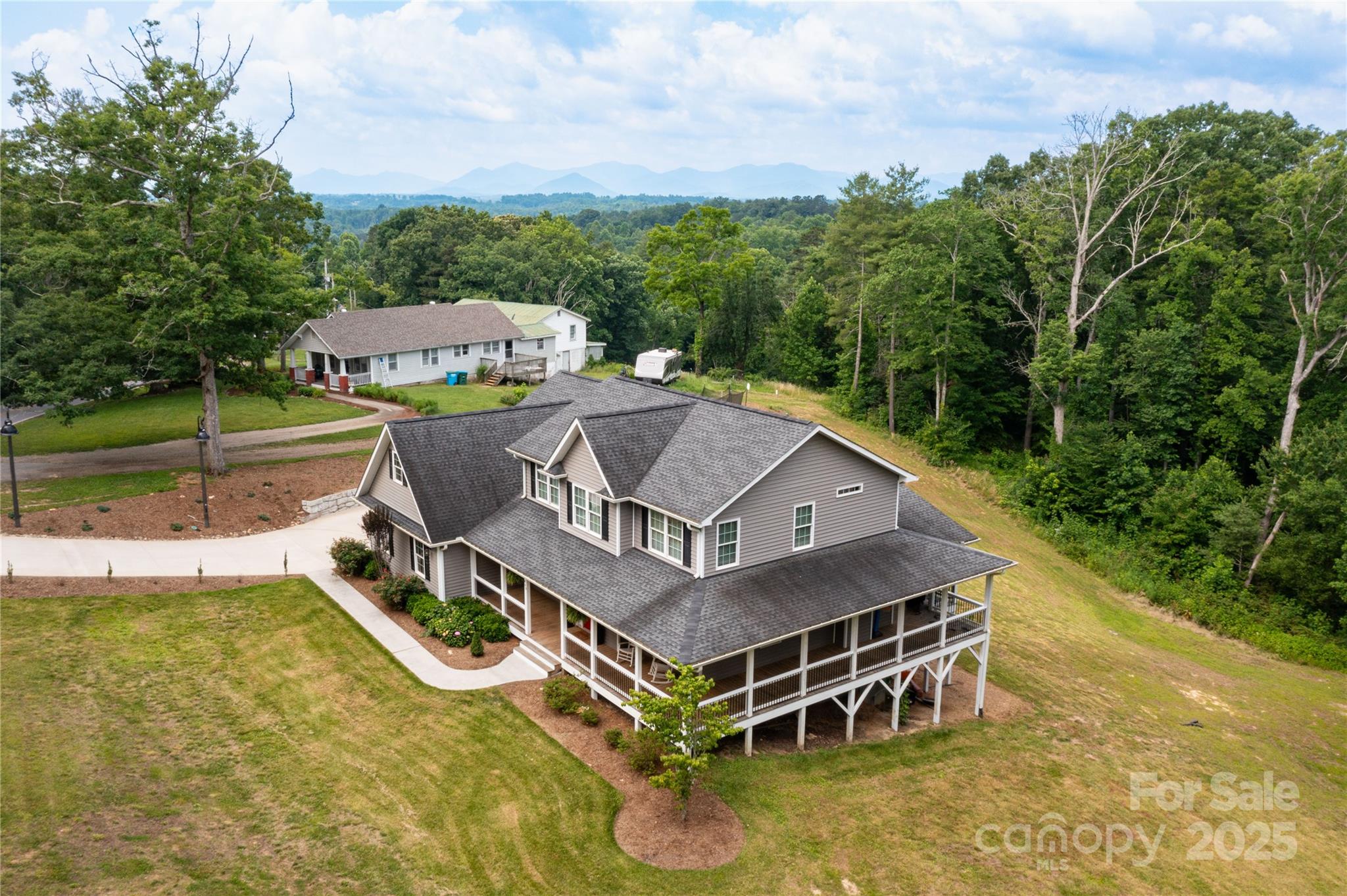 460 Panther Branch Road Alexander, NC 28701 - Photo 3 of 32 an aerial view of a house with swimming pool garden view and lake view