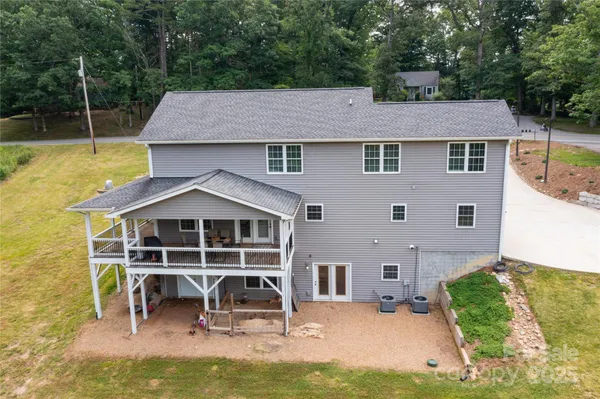 a aerial view of a house with swimming pool and sitting area