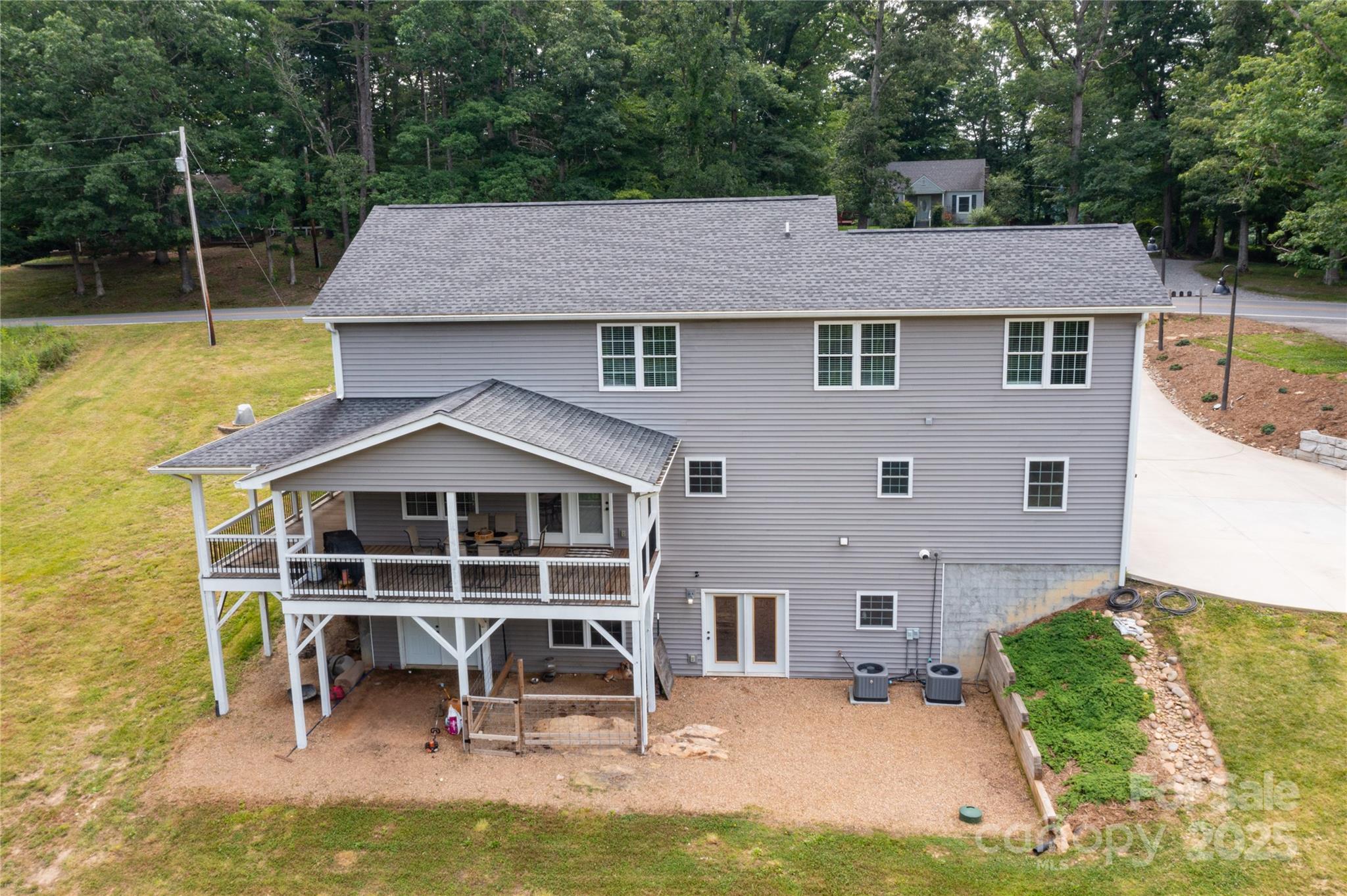460 Panther Branch Road Alexander, NC 28701 - Photo 4 of 32 a aerial view of a house with swimming pool and sitting area