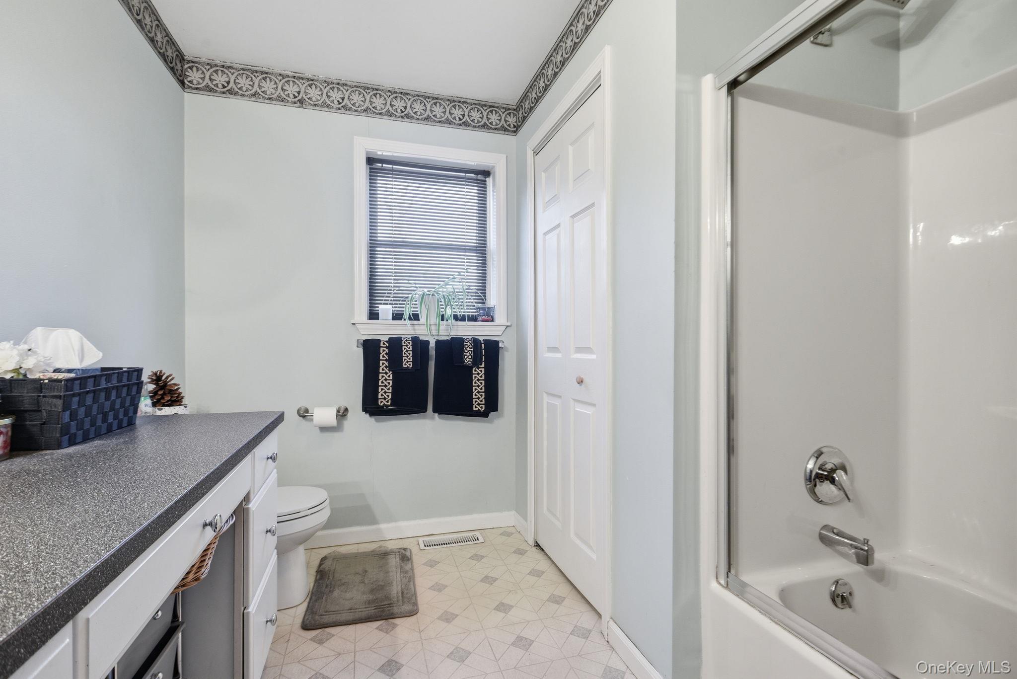 25 De Garmo Road Poughkeepsie, NY 12603 - Photo 34 of 50 a bathroom with a granite countertop sink a toilet and bathtub