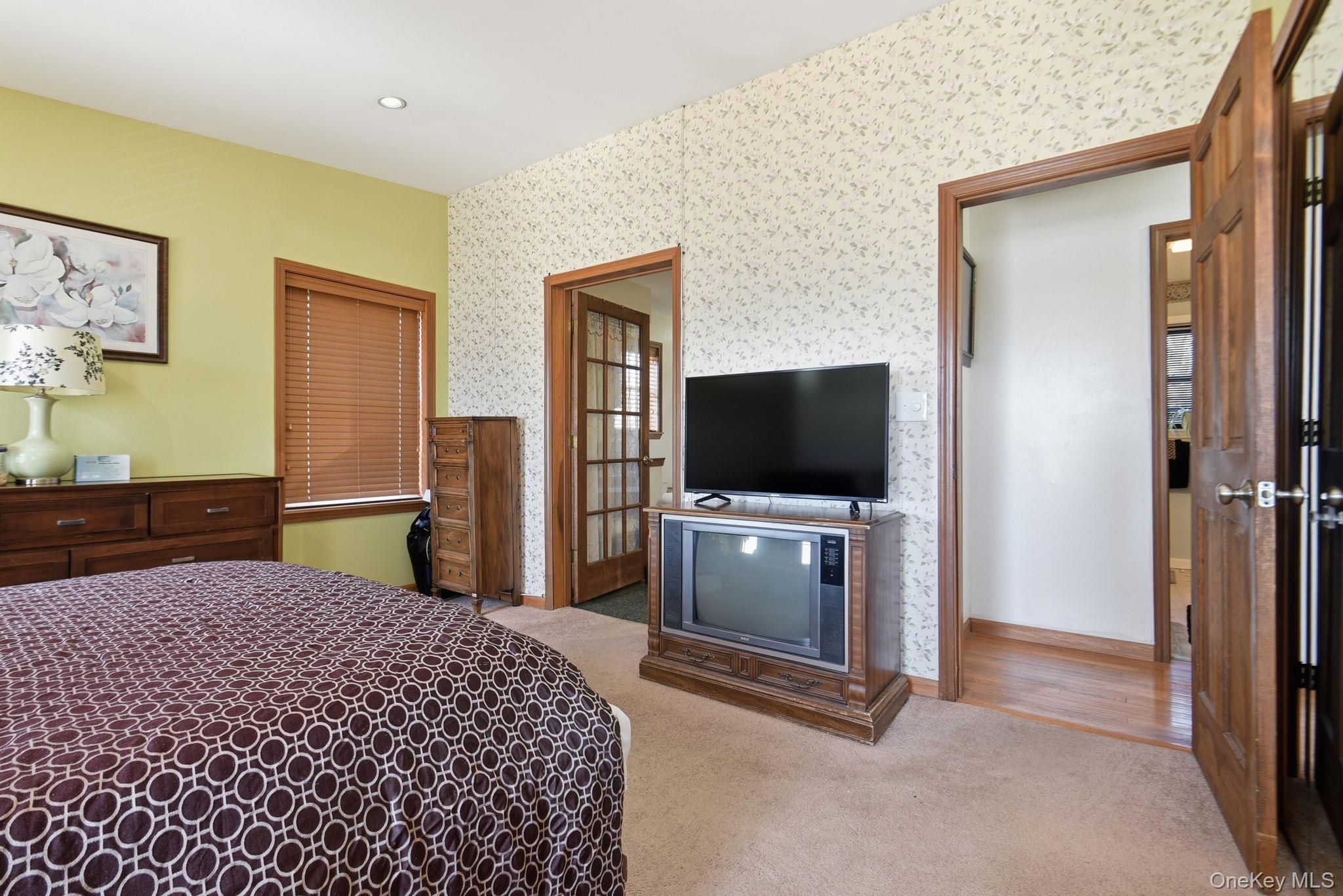 25 De Garmo Road Poughkeepsie, NY 12603 - Photo 38 of 50 a bedroom with a bed and a flat screen tv