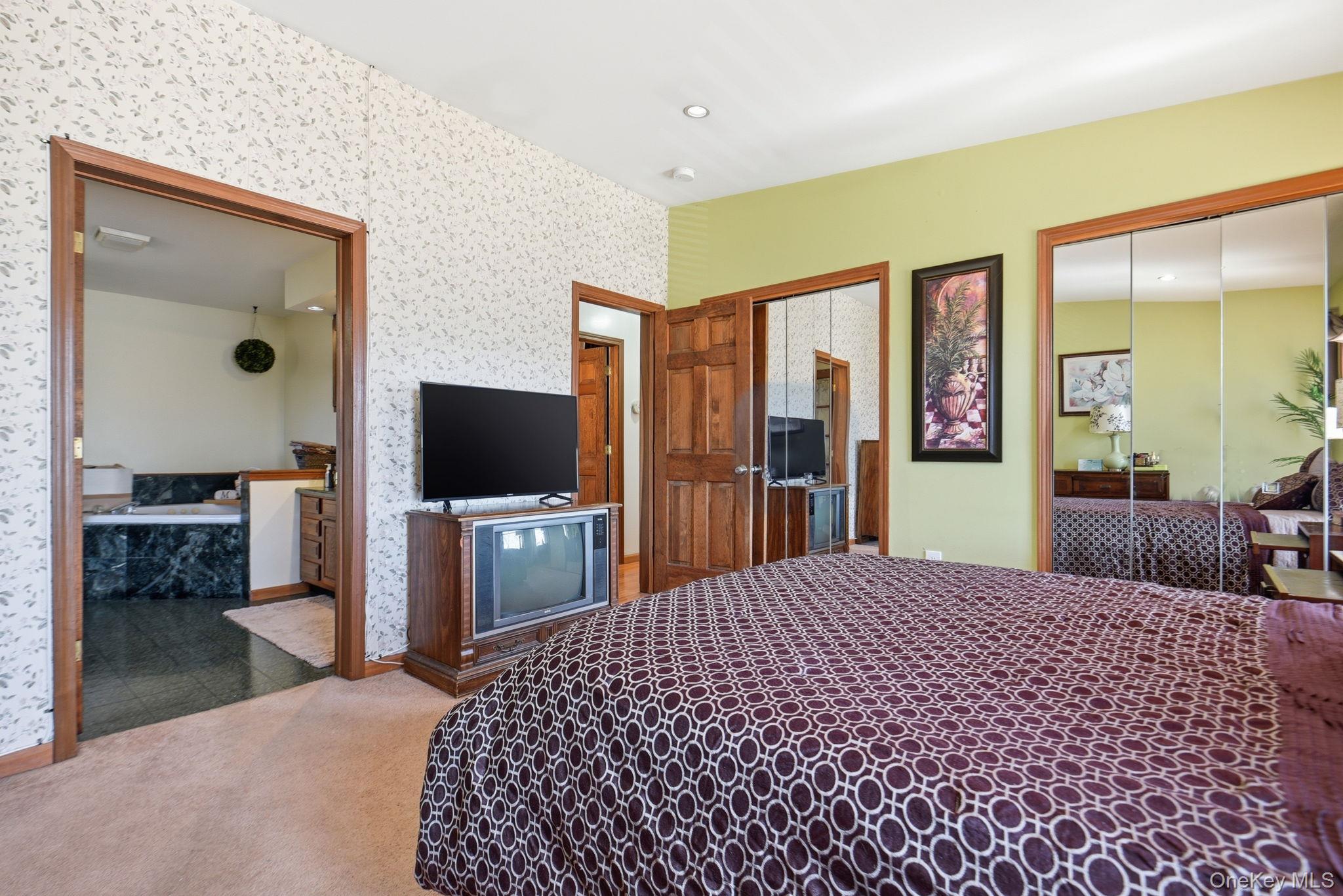 25 De Garmo Road Poughkeepsie, NY 12603 - Photo 39 of 50 a bedroom with a bed and a flat screen tv