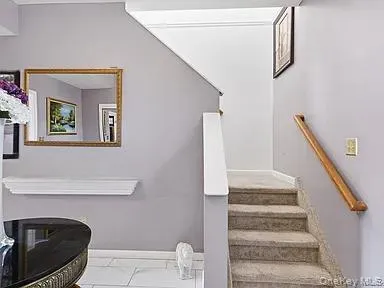 a view of staircase with white walls and stair