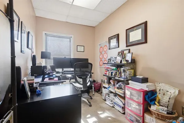 a view of a workspace with furniture