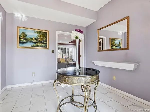 a dining room with table and chairs