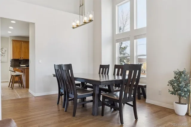 a view of a dining room with furniture window and wooden floor