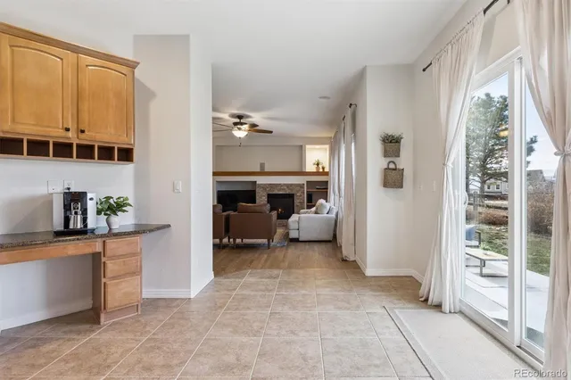 a kitchen with a refrigerator and a stove top oven