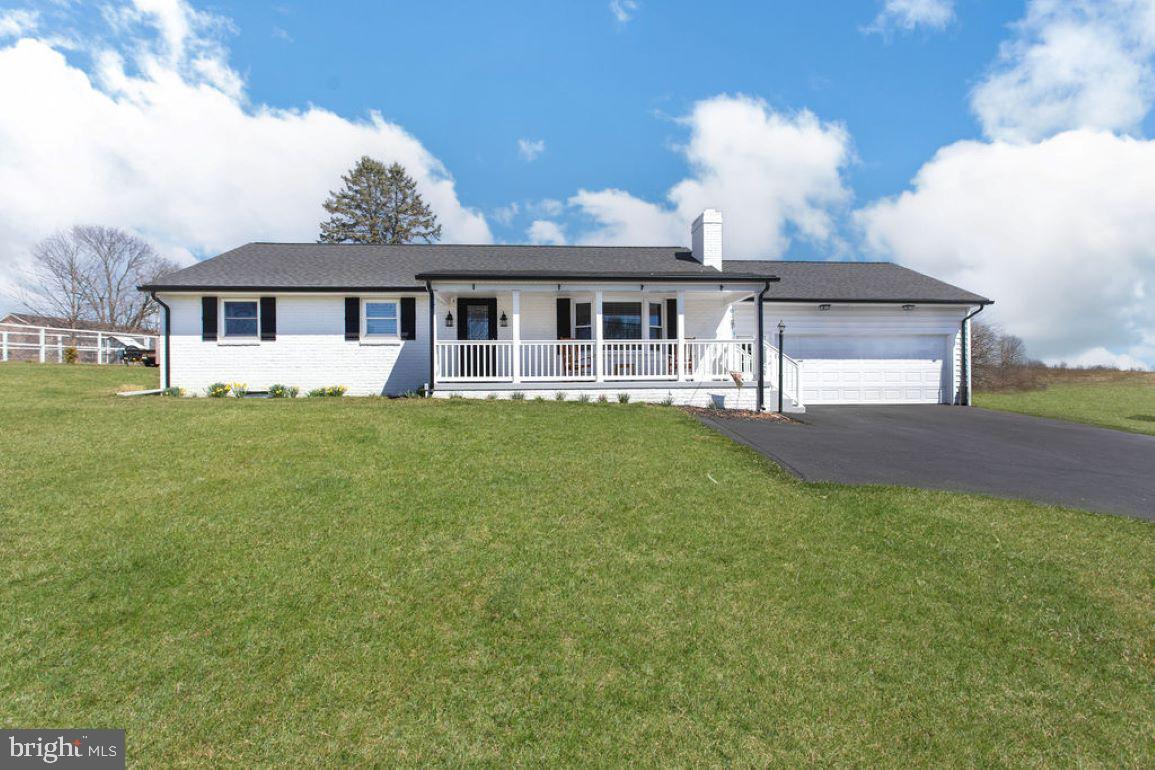 2970 Baltimore Pike Hanover, PA 17331 - Photo 2 of 30 a front view of a house with a garden and yard
