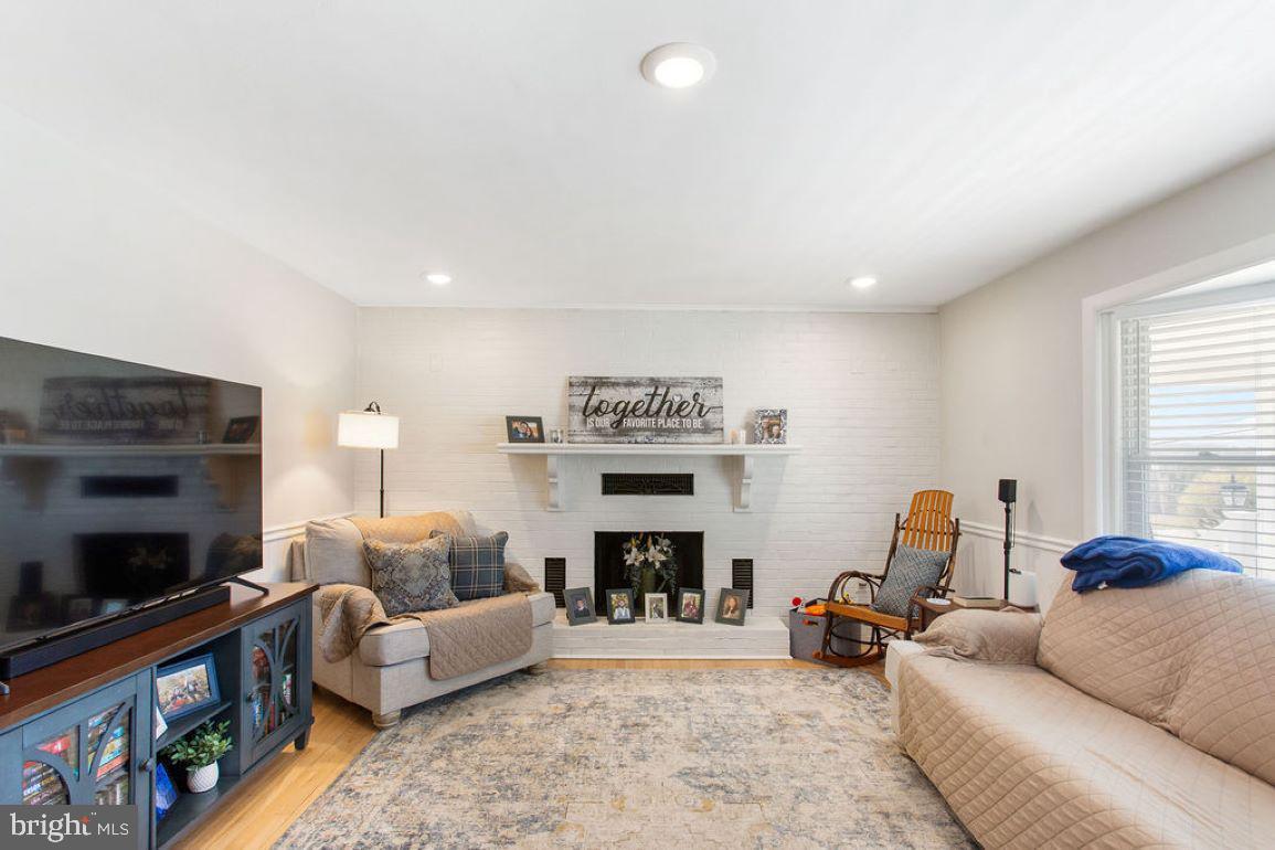 2970 Baltimore Pike Hanover, PA 17331 - Photo 4 of 30 a living room with furniture a flat screen tv and a fireplace