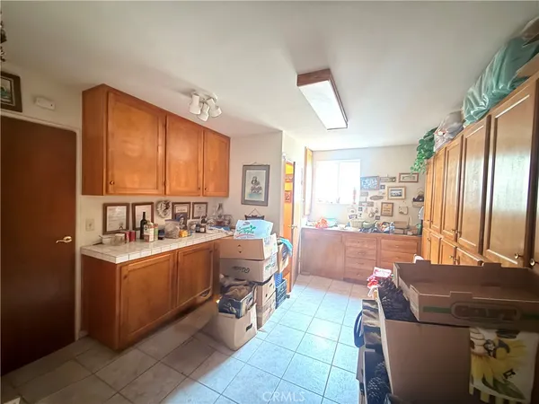 a view of kitchen with stainless steel appliances granite countertop a sink a stove and refrigerator
