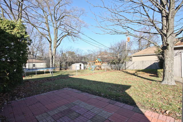 557 Sumac Road Highland Park, IL 60035 - Photo 17 of 20 a view of yard with tree in the background