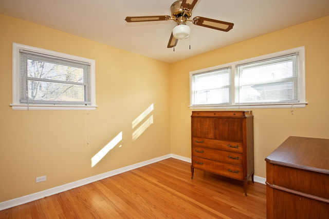 557 Sumac Road Highland Park, IL 60035 - Photo 8 of 20 a view of empty room with wooden floor and fan