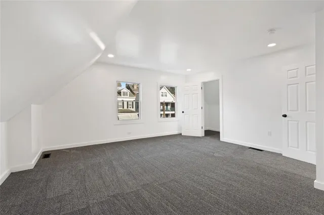 an empty room with a bathroom