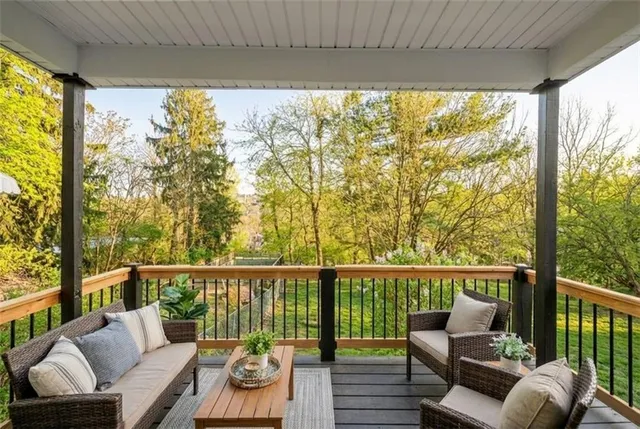 a view of a balcony with wooden floor