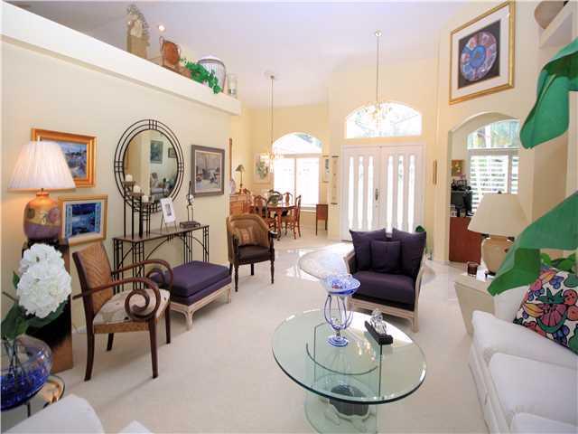 100 South River Road Stuart, FL 34996 - Photo 4 of 21 a living room with furniture chandelier and a large window
