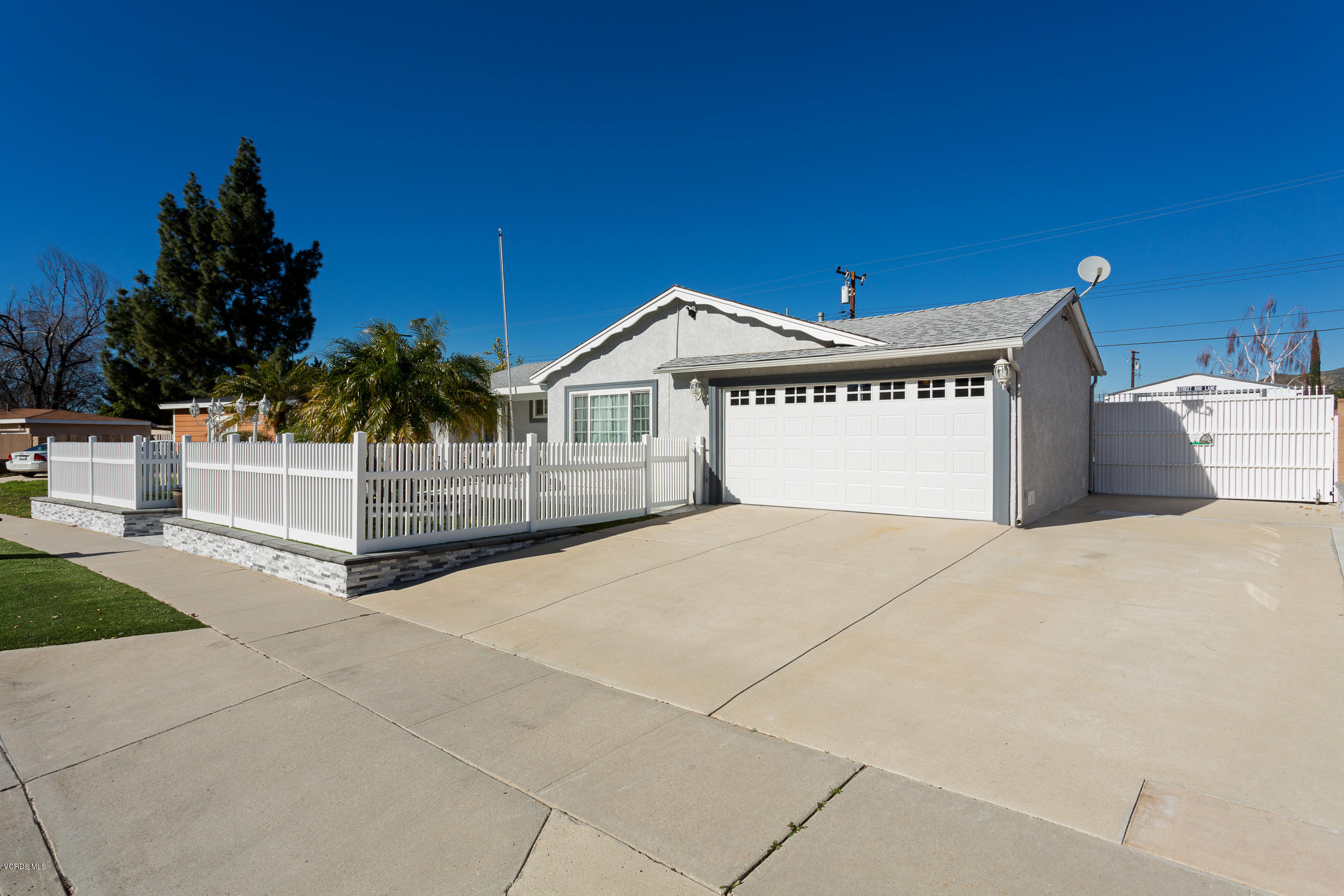 6295 Caroline Avenue Simi Valley, CA 93063 - Photo 1 of 27 a front view of a house with a yard