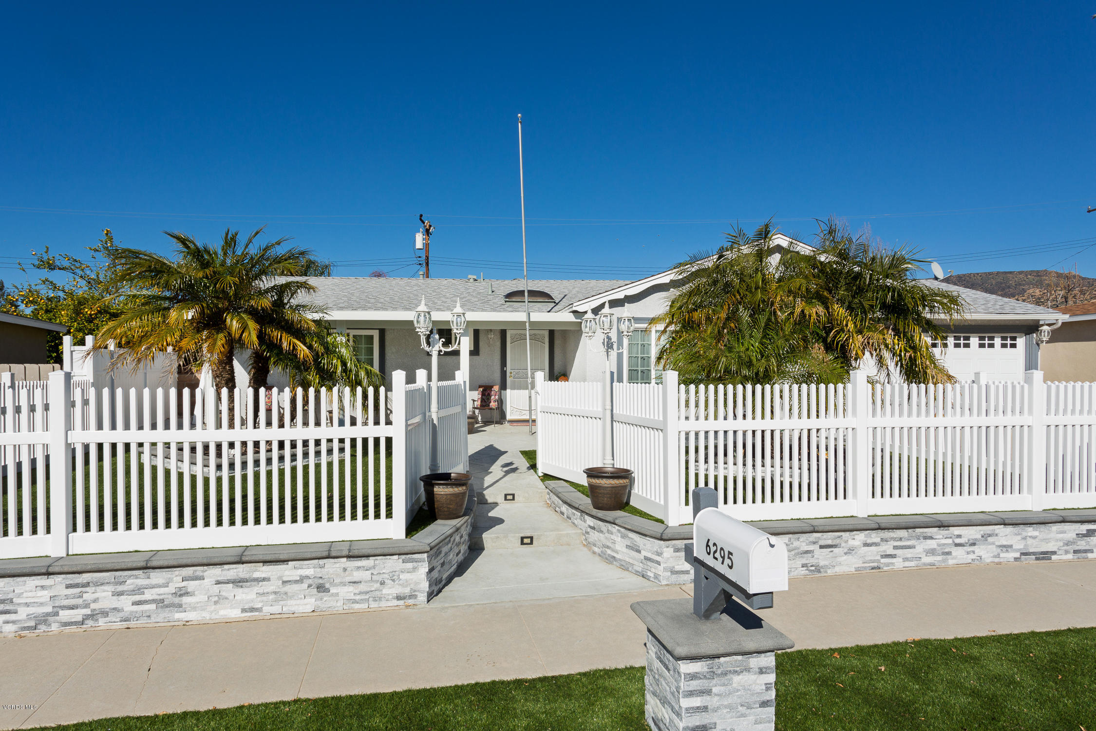 6295 Caroline Avenue Simi Valley, CA 93063 - Photo 2 of 27 a view of a house with a fence