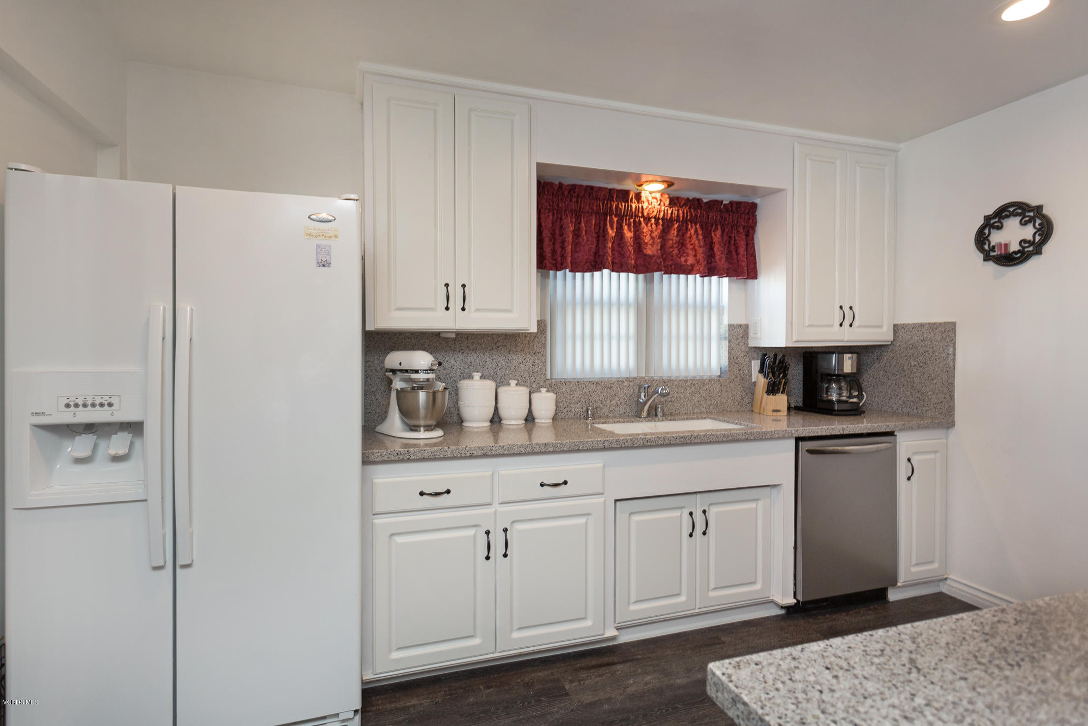 6295 Caroline Avenue Simi Valley, CA 93063 - Photo 11 of 27 a kitchen with white cabinets and white appliances