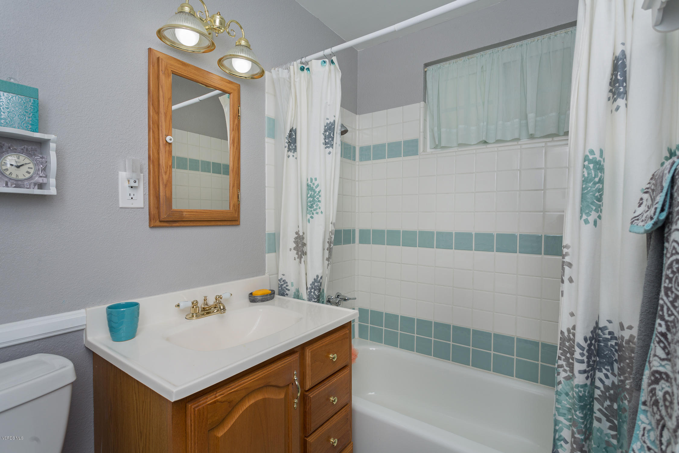 6295 Caroline Avenue Simi Valley, CA 93063 - Photo 20 of 27 a bathroom with a sink vanity granite tub shower and a mirror