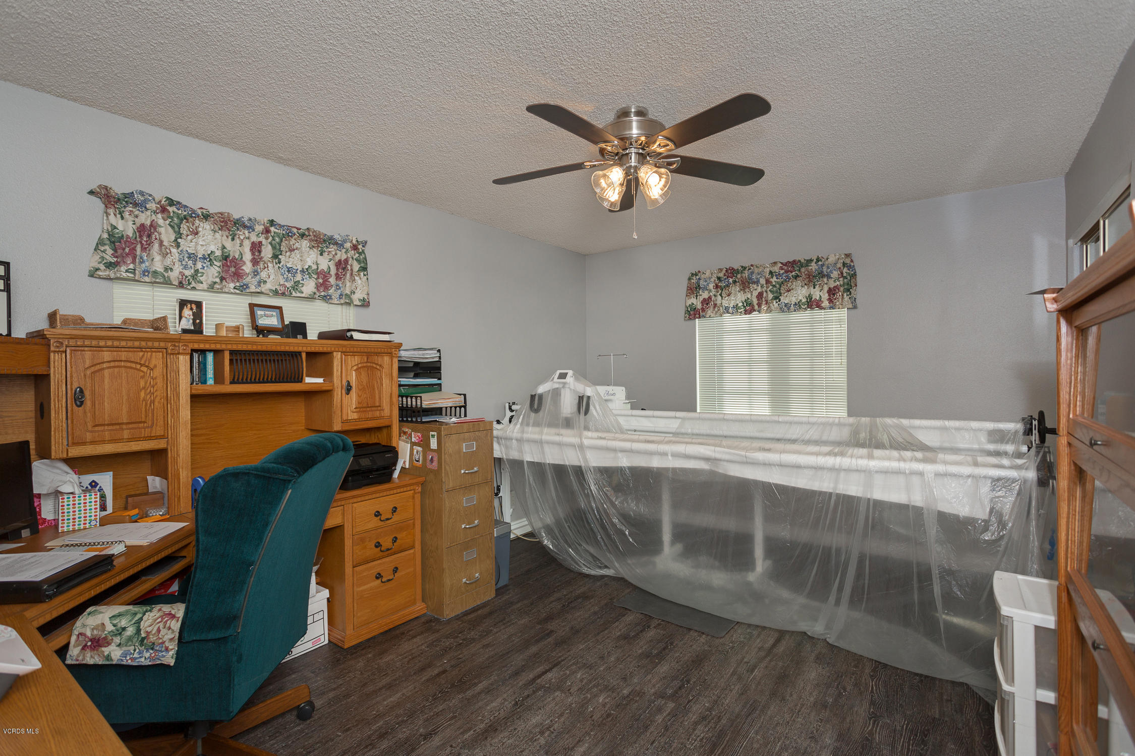 6295 Caroline Avenue Simi Valley, CA 93063 - Photo 22 of 27 a view of a workspace with wooden floor and bedroom view