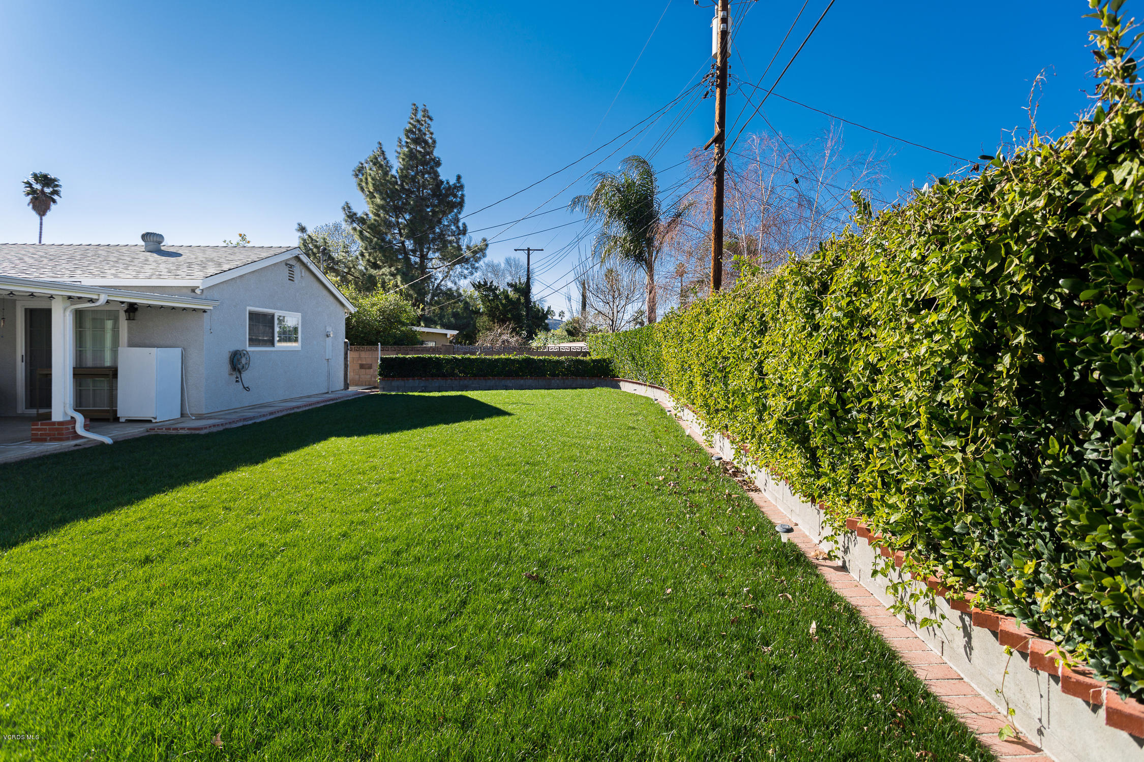 6295 Caroline Avenue Simi Valley, CA 93063 - Photo 24 of 27 a view of a house with a backyard