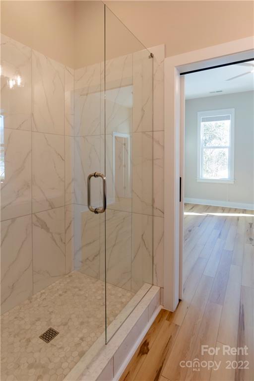 309 Houston Street, Unit B Davidson, NC 28036 - Photo 10 of 15 a bathroom with a shower