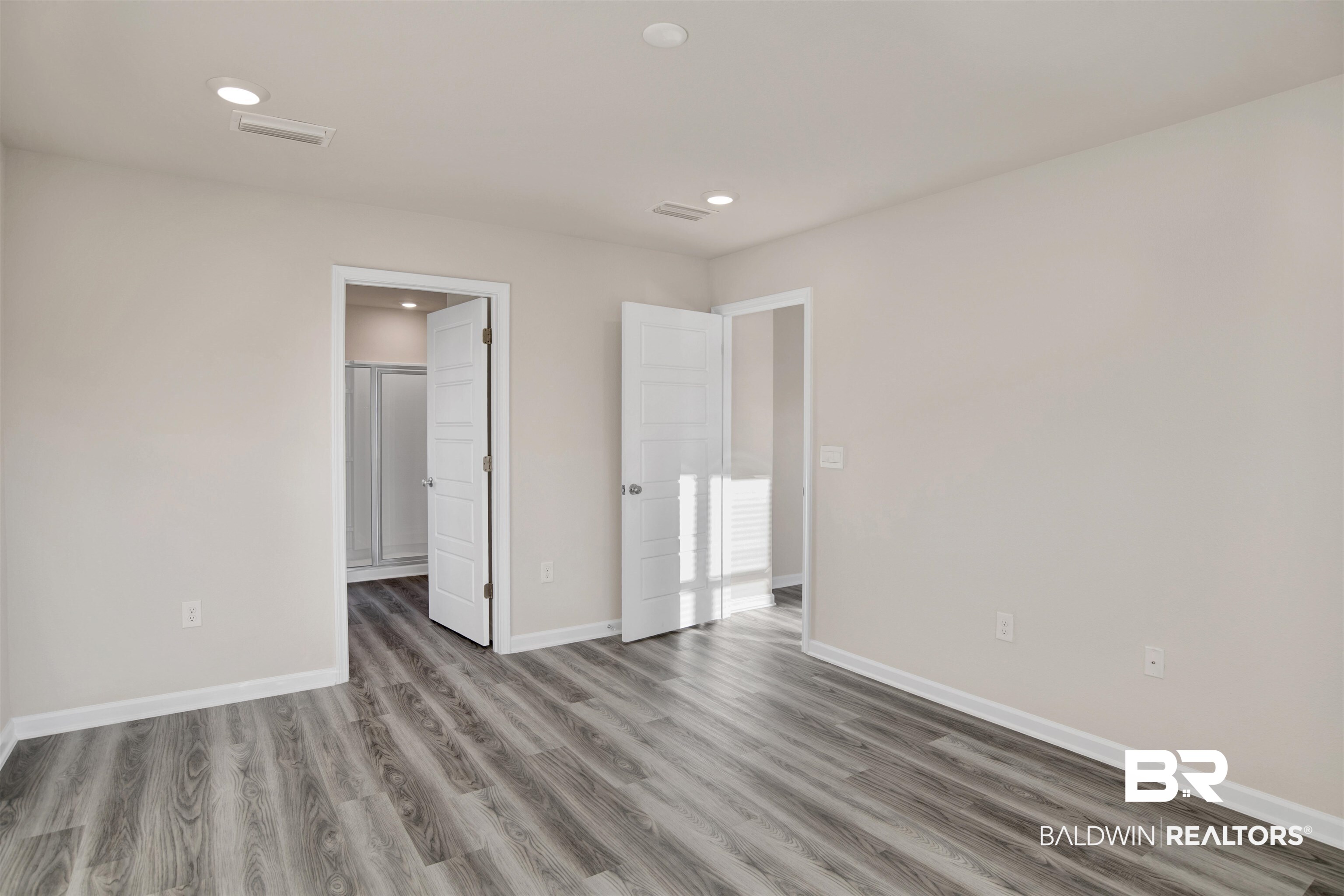 32038 Lyon Road Daphne, AL 36527 - Photo 20 of 30 Unfurnished bedroom with light wood-type flooring, recessed lighting, and connected bathroom