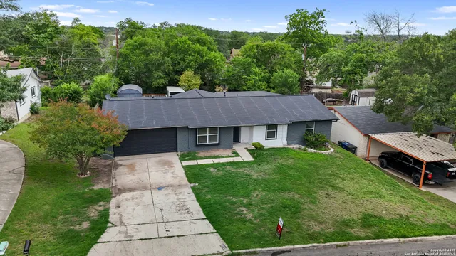 an aerial view of a house with garden