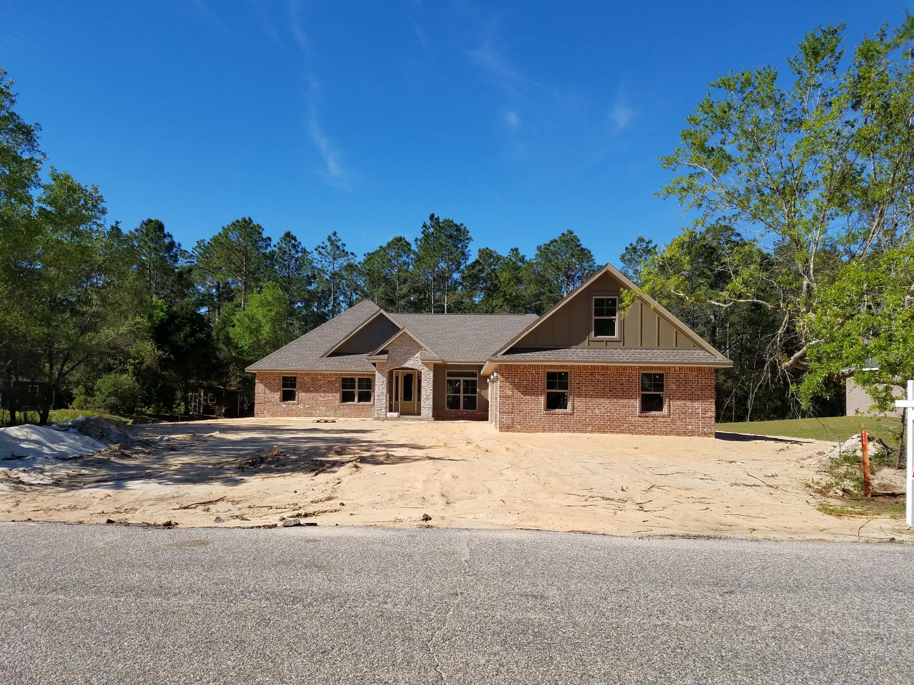 2585 Cove Road Navarre, FL 32566 - Photo 2 of 47 a house with a outdoor space