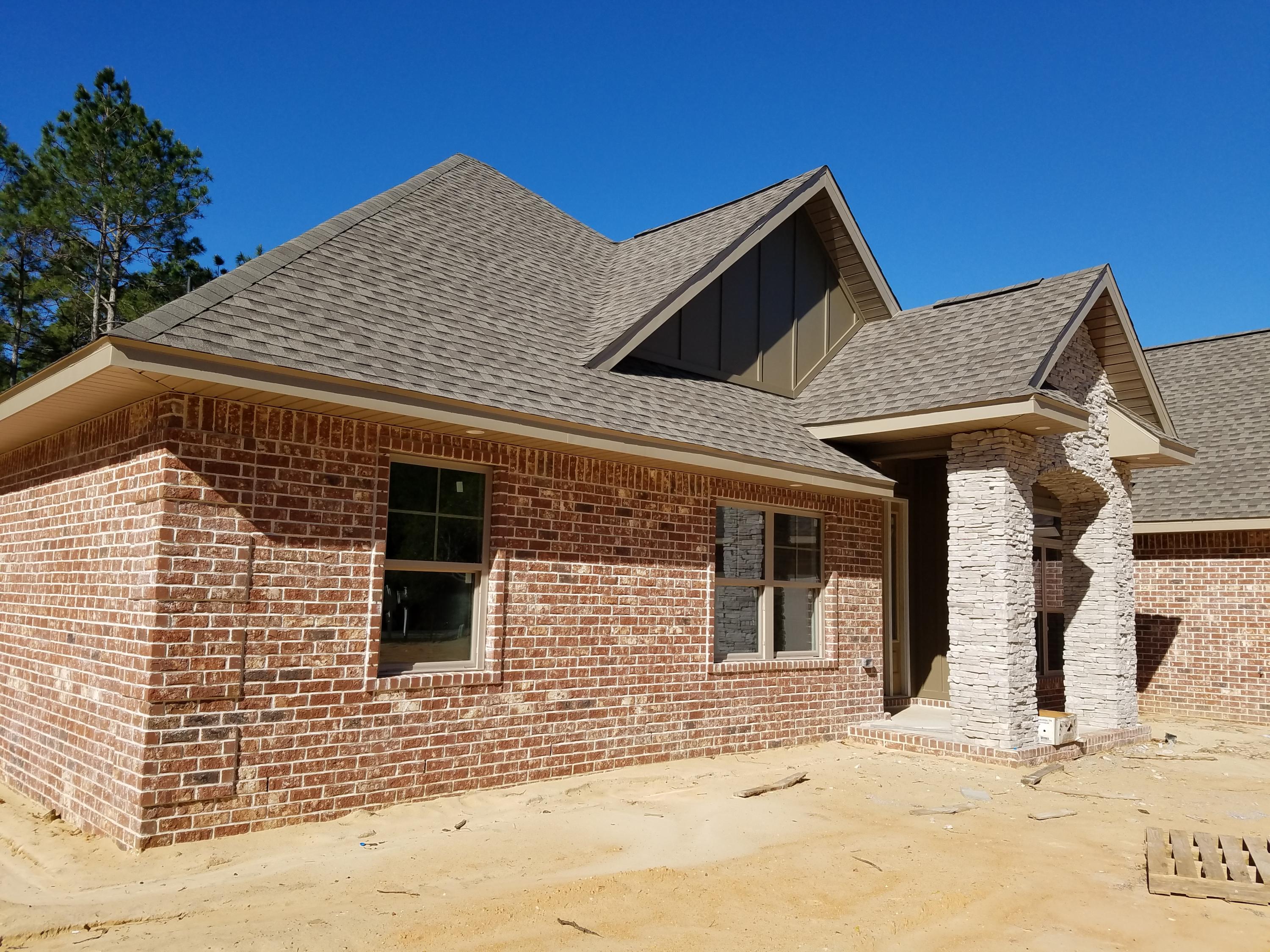 2585 Cove Road Navarre, FL 32566 - Photo 3 of 47 a front view of a house