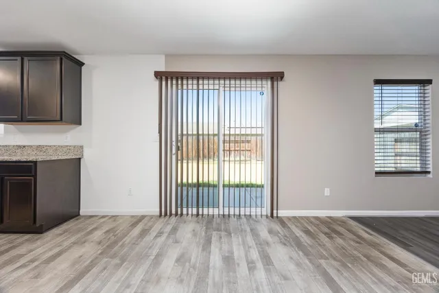 a kitchen with stainless steel appliances granite countertop a stove and a sink