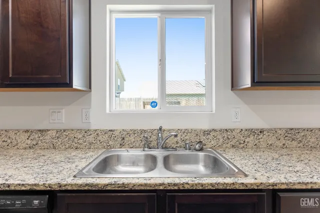 a view of a kitchen cabinets and wooden floor