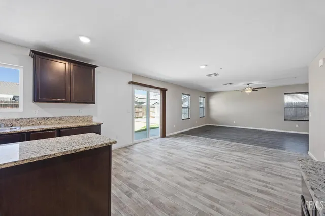 a bathroom with a sink toilet and a mirror