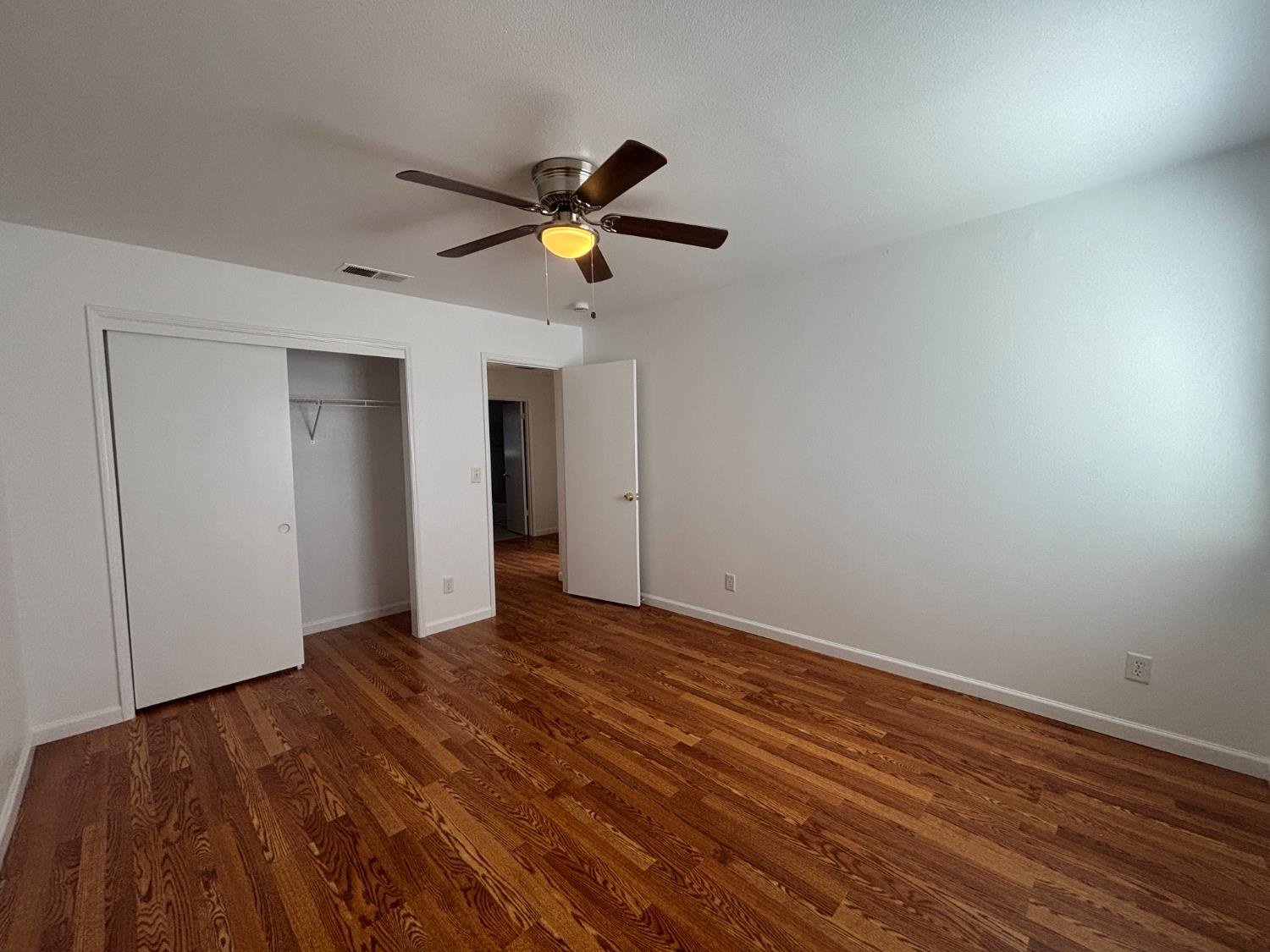 813 Morton Avenue Sanger, CA 93657 - Photo 13 of 19 a view of empty room with wooden floor