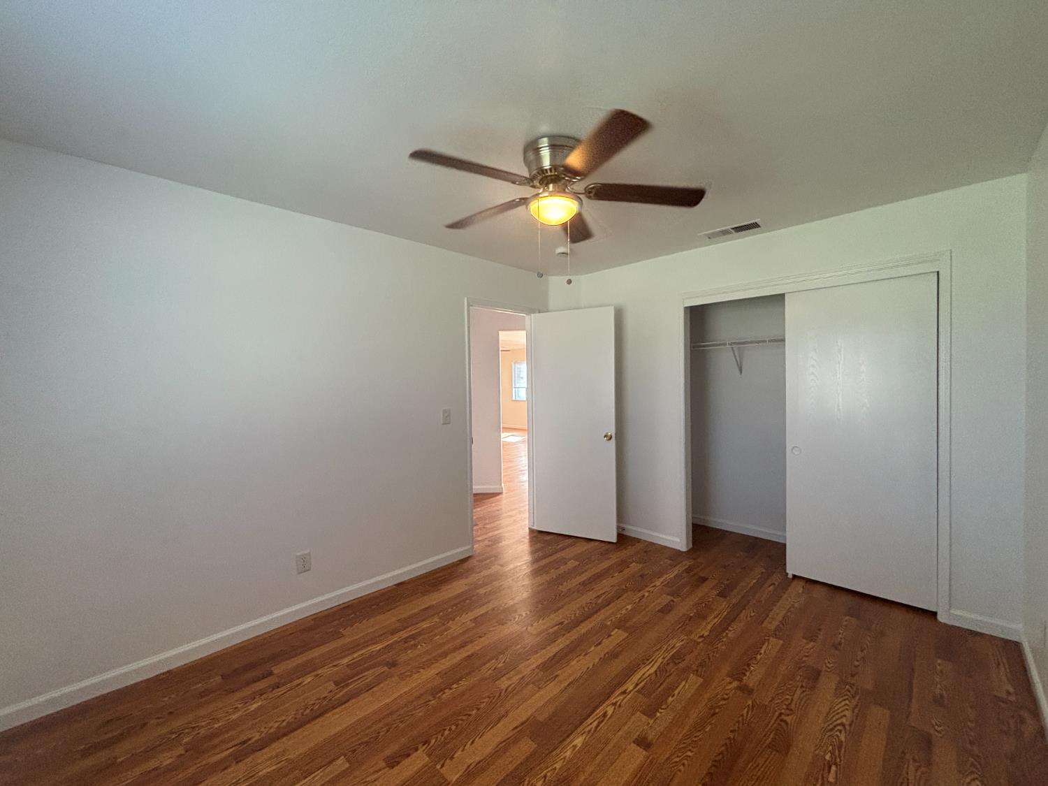 813 Morton Avenue Sanger, CA 93657 - Photo 15 of 19 a view of an empty room and wooden floor