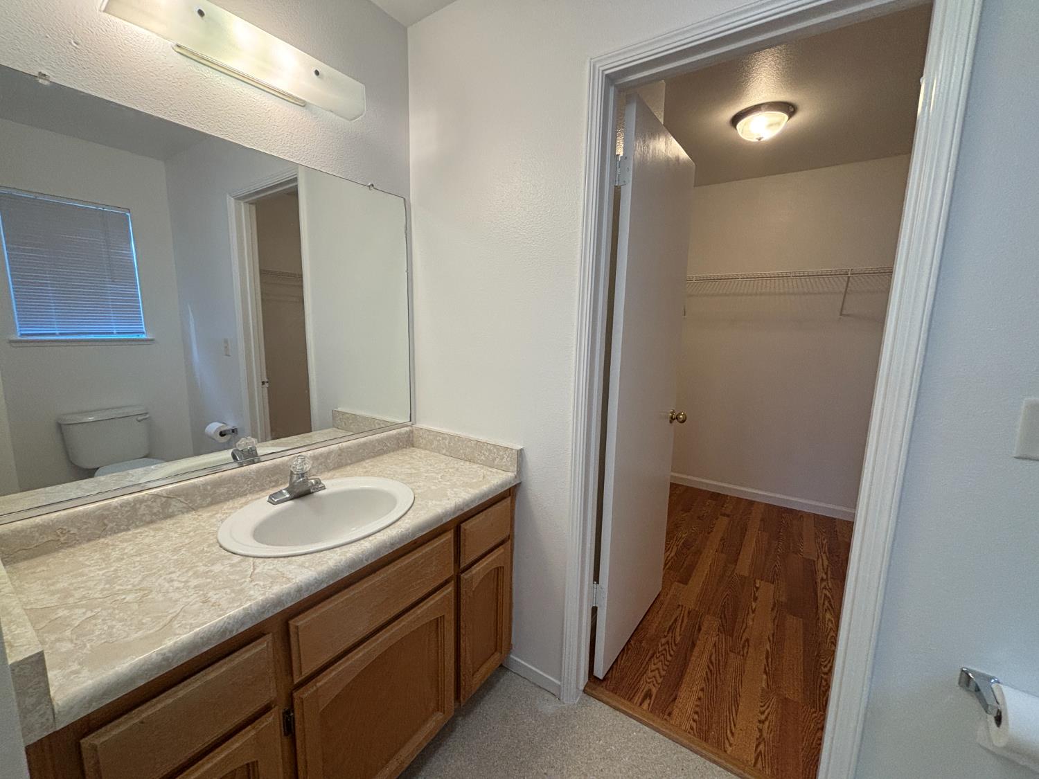 813 Morton Avenue Sanger, CA 93657 - Photo 10 of 19 a bathroom with a sink a mirror and a shower