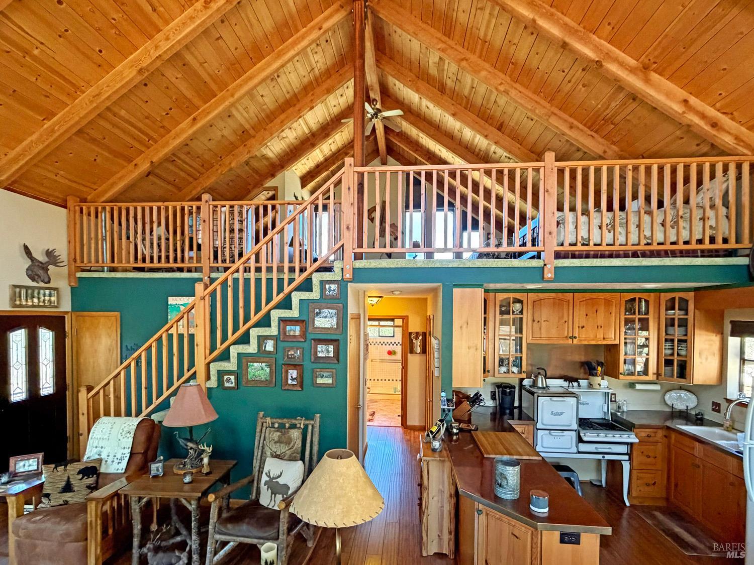 31312 High Point Road Potter Valley, CA 95469 - Photo 20 of 58 a view of a dining room with furniture window and wooden floor