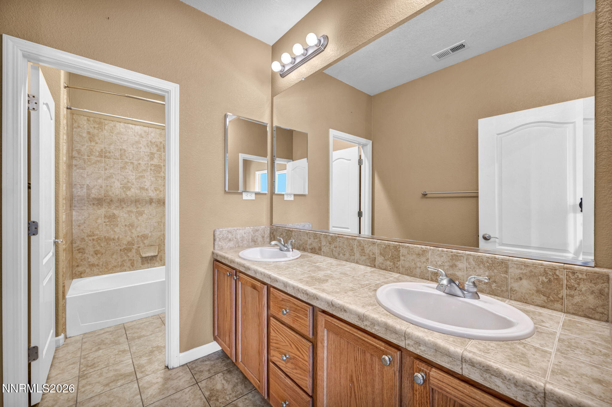 475 Parade Drive Reno, NV 89521 - Photo 106 of 113 a bathroom with a granite countertop sink and a mirror