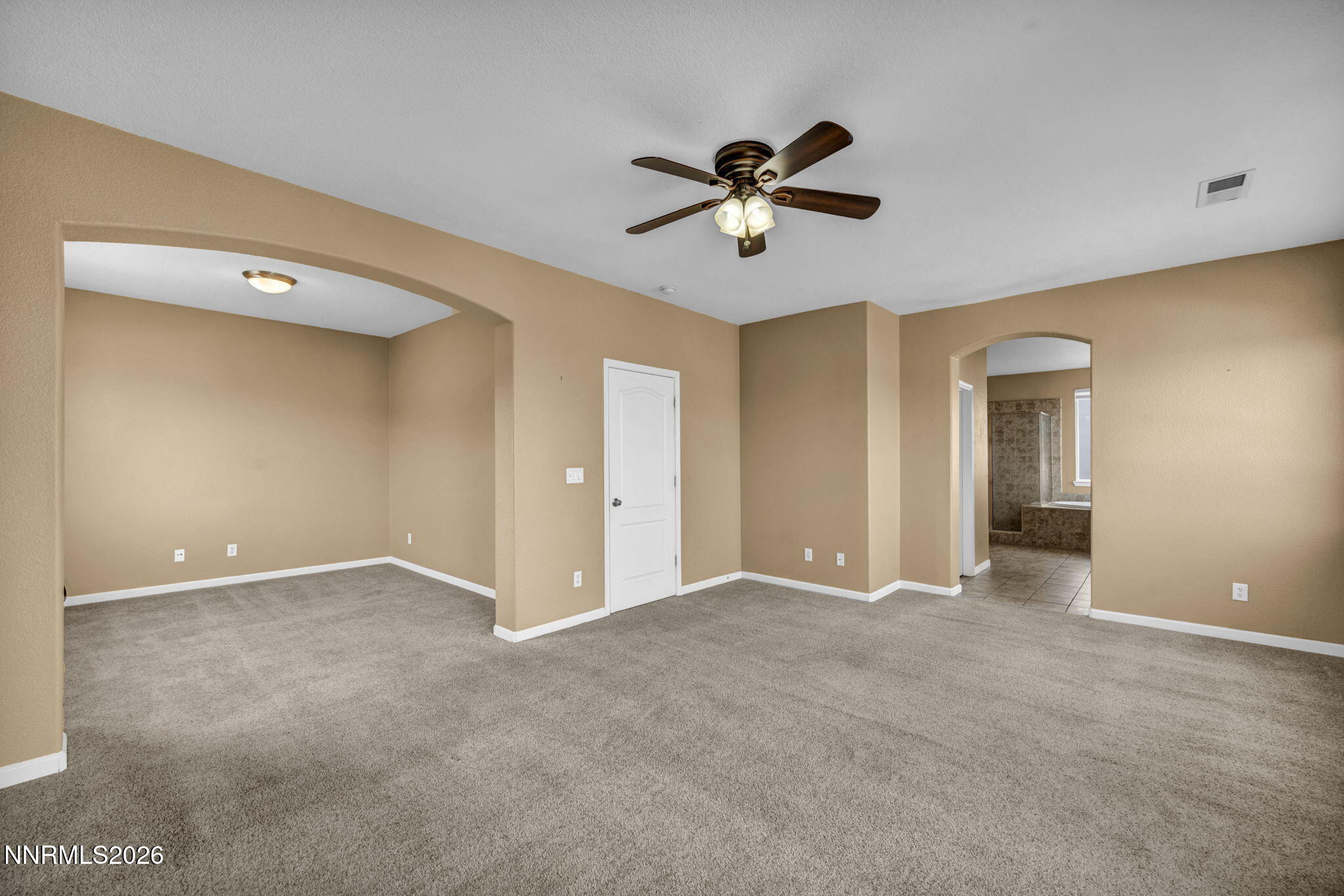 475 Parade Drive Reno, NV 89521 - Photo 19 of 113 a view of an empty room with a ceiling fan