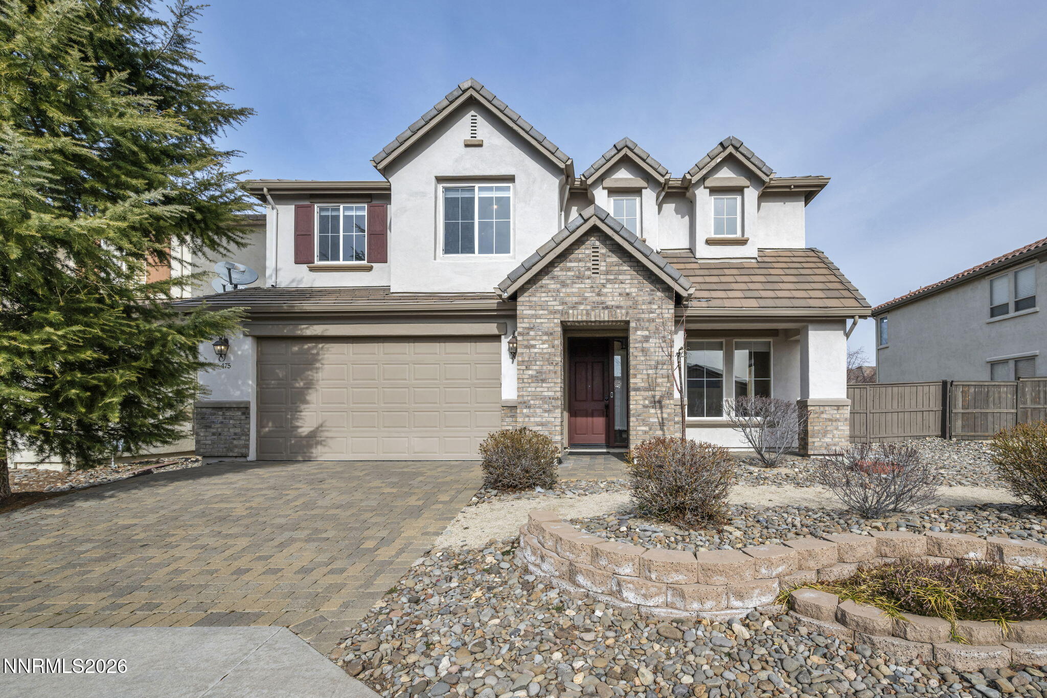 475 Parade Drive Reno, NV 89521 - Photo 2 of 113 a front view of a house with a yard and garage