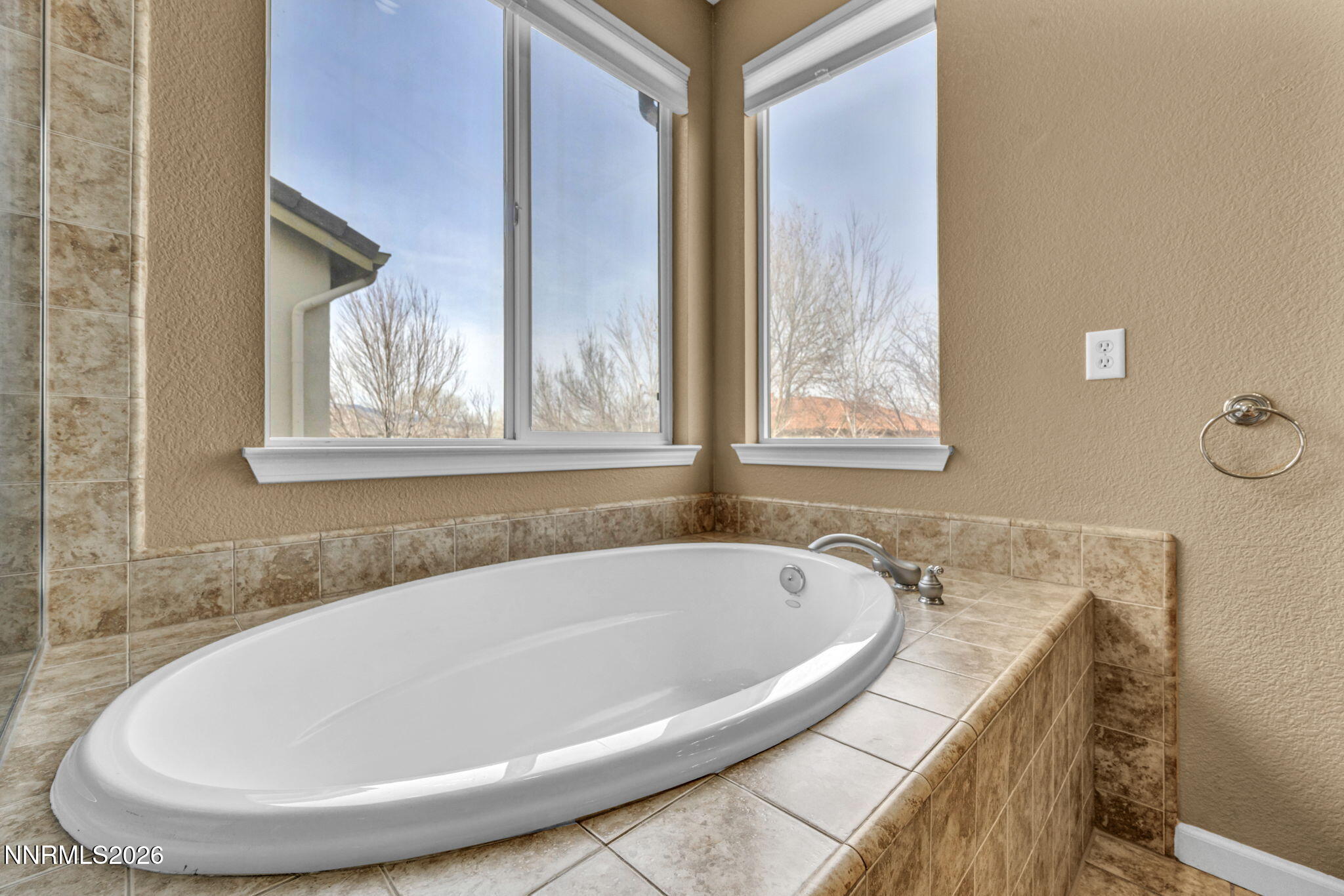 475 Parade Drive Reno, NV 89521 - Photo 23 of 113 a white bath tub sitting in a bathroom next to a window