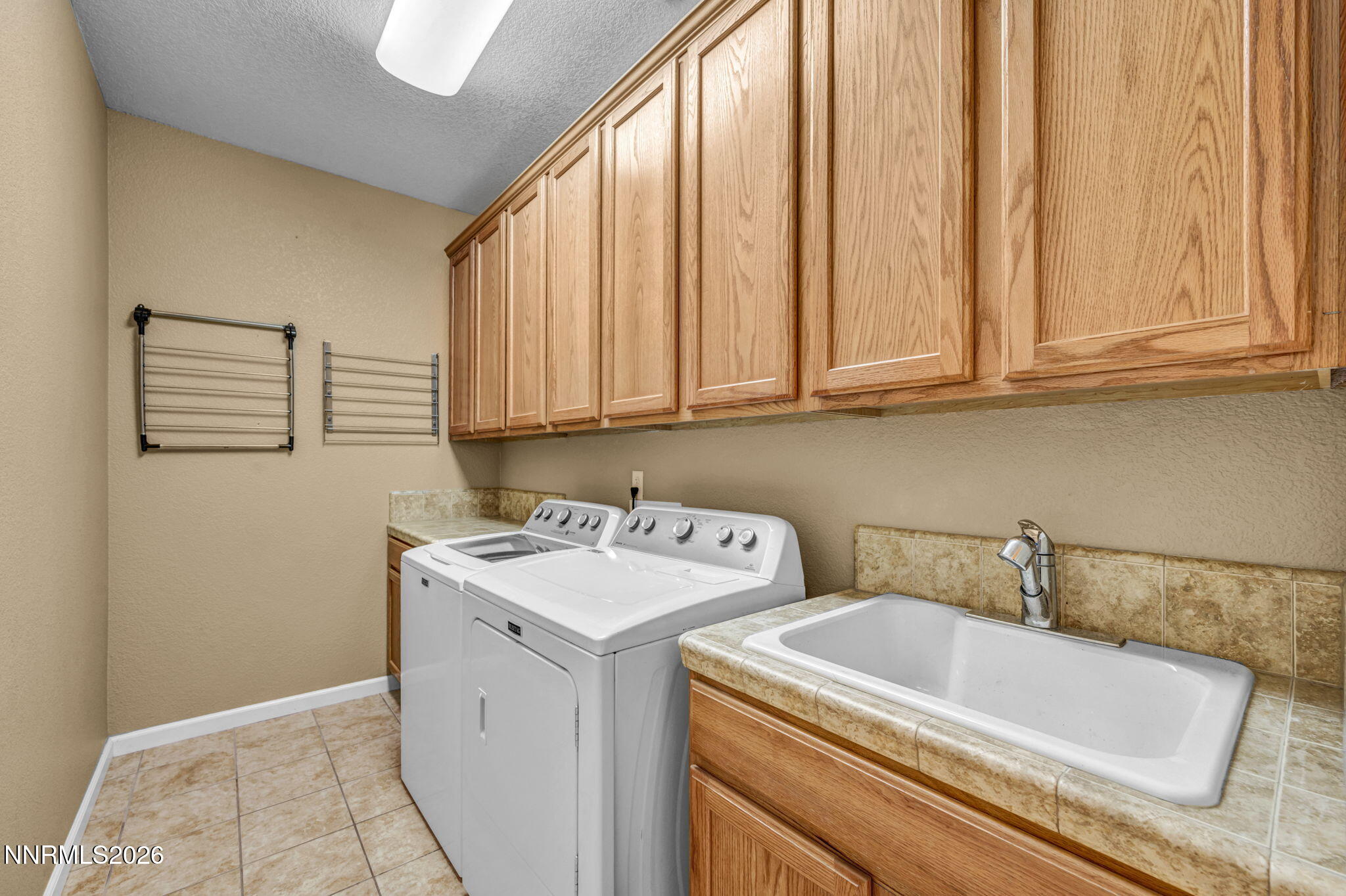 475 Parade Drive Reno, NV 89521 - Photo 27 of 113 a utility room with dryer and washer
