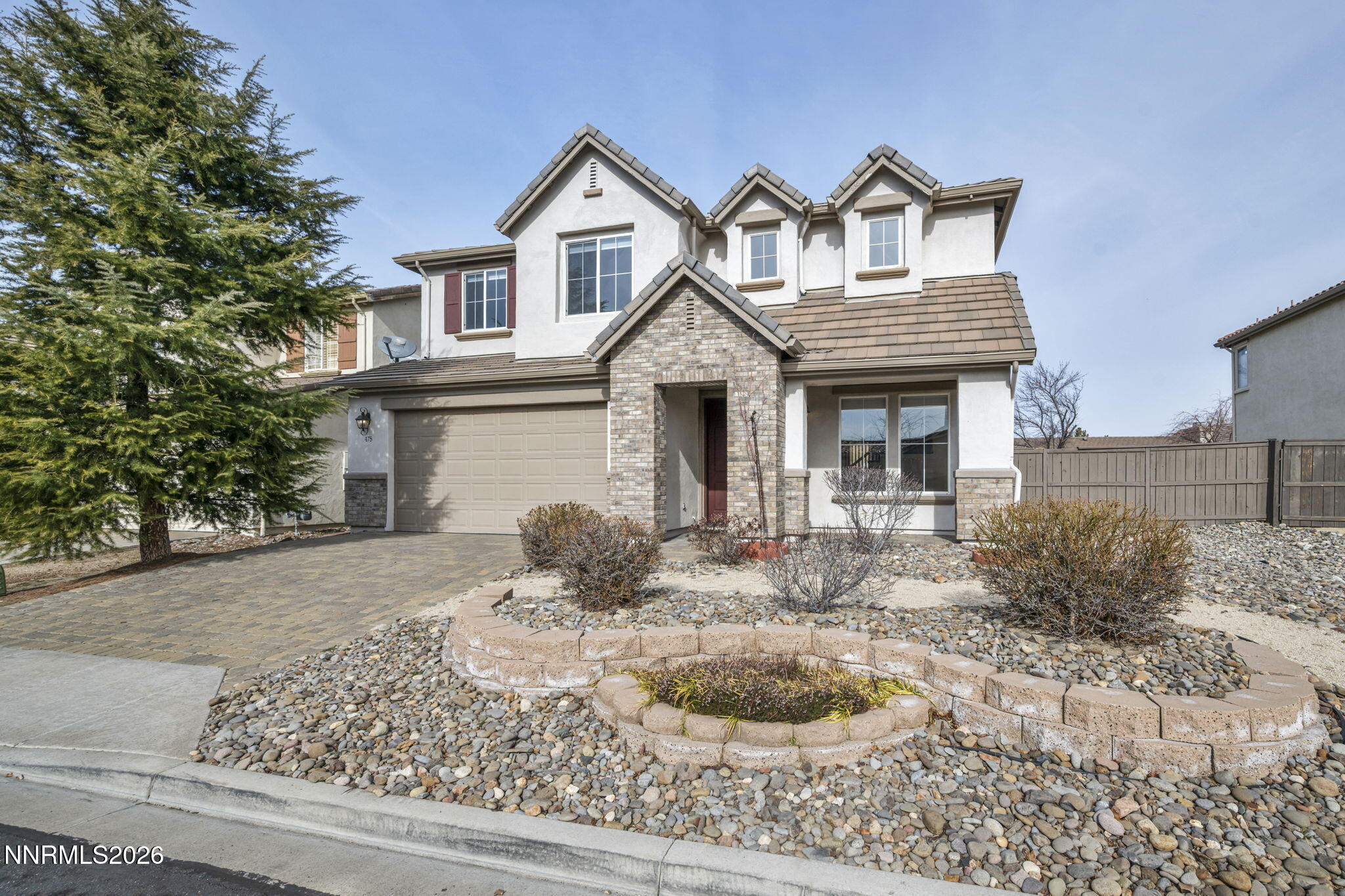 475 Parade Drive Reno, NV 89521 - Photo 3 of 113 a front view of a house with a yard