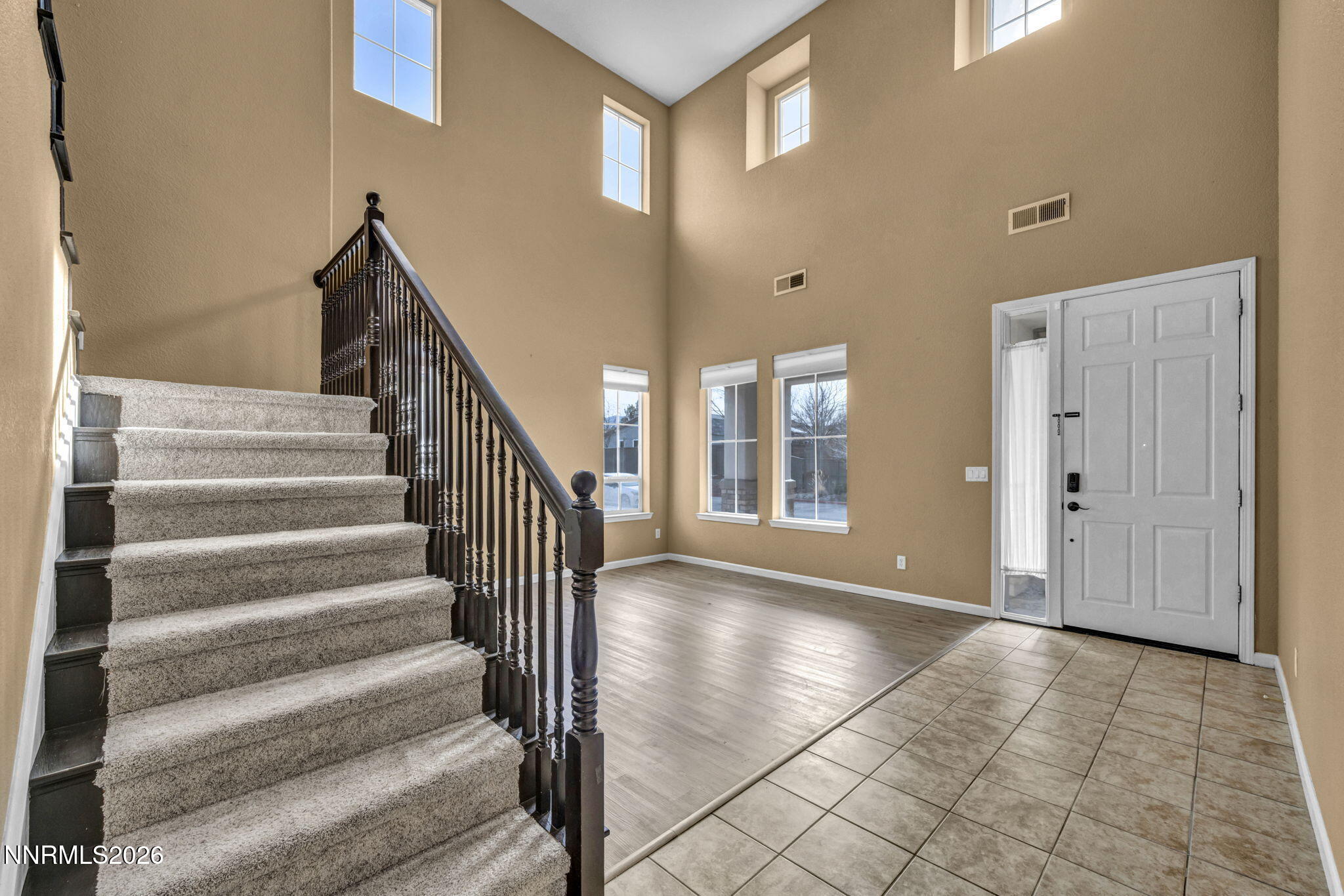 475 Parade Drive Reno, NV 89521 - Photo 46 of 113 a view of an entryway with wooden floor and stairs
